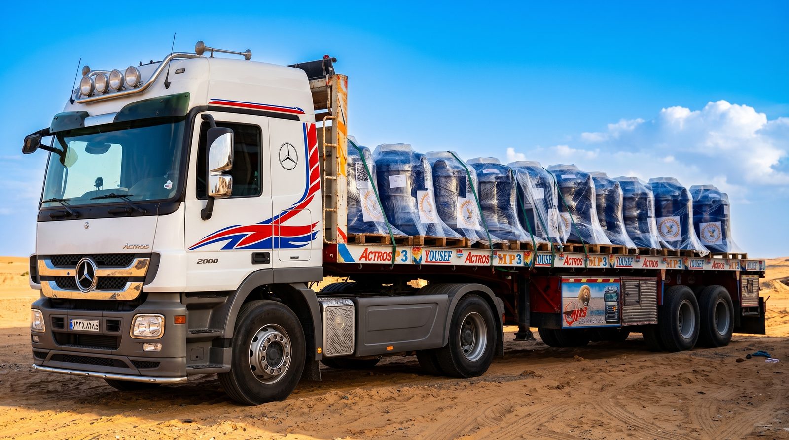 Plastic tanks secured on flatbed for delivery